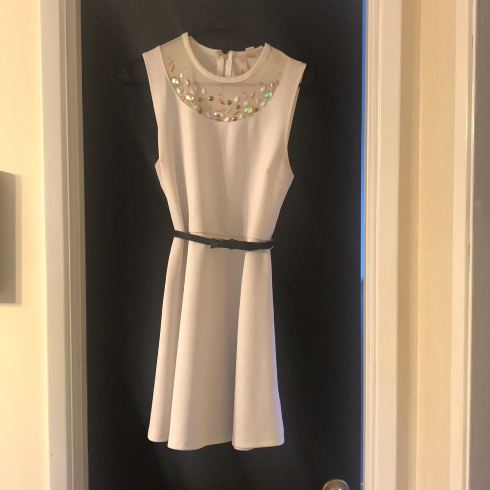 White dress with a fun beaded neckline and belt